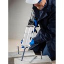 Worker filling cinder block with the Nordson EFD 2K Manual Top Load Dispenser