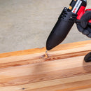 Close-up of the Tec 806-12 glue gun filling a wood knot with hot melt adhesive for repair.