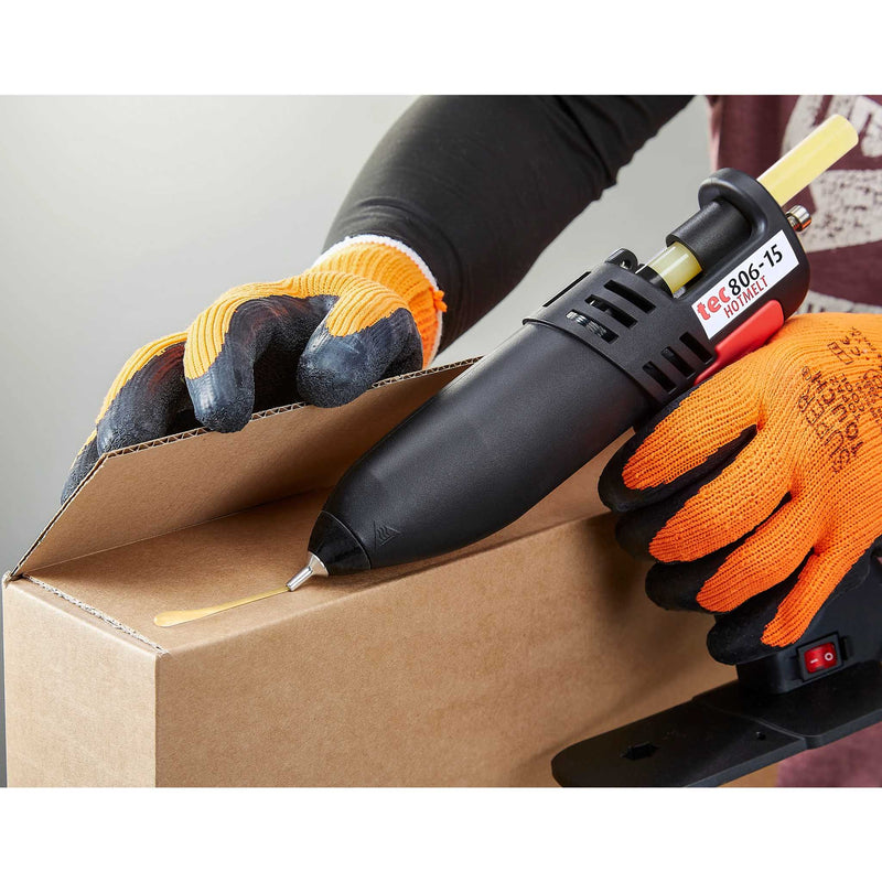 Worker sealing a cardboard box using TEC Bond 214B with a hot glue gun