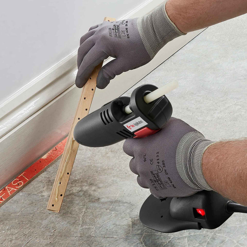 Worker using the Power Adhesives TEC 830 Glue Gun on edging