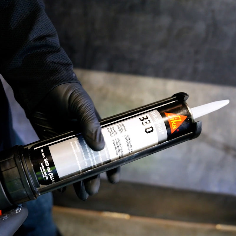 300 ml Cartridge of SikaSeal 330 Heat Curing Seam Sealant in a Dispensing Gun