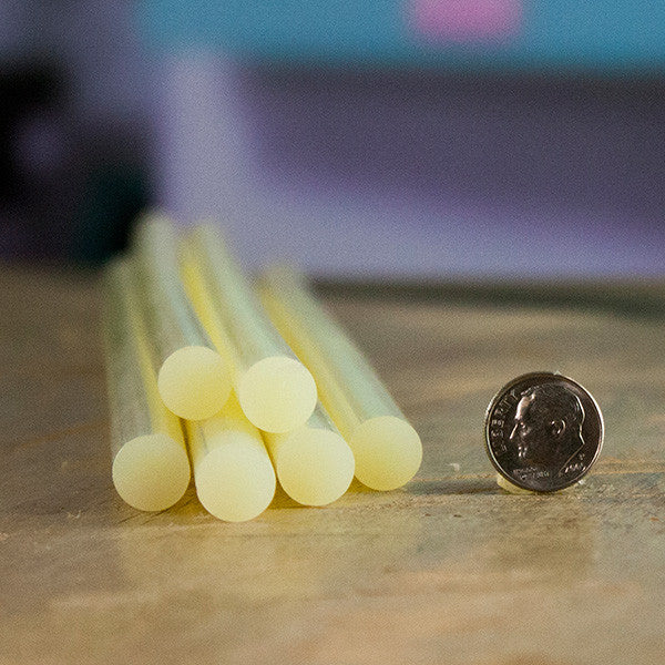 Surebonder 703 packaging glue sticks and dime size comparison